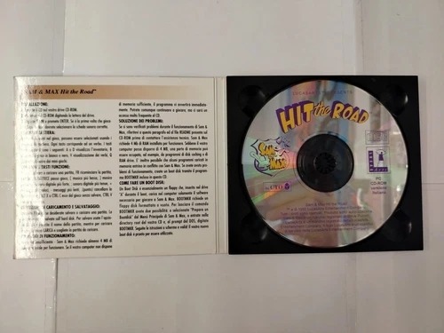 Estojo aberto · CD-ROM e instruções em italiano.